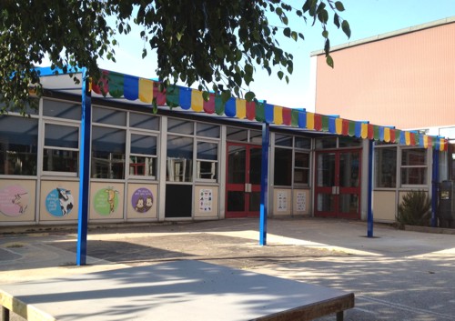 The Coniston Wall Mounted Canopy with the Rainbow Package installed at Templars Primary & Nursery School in Essex